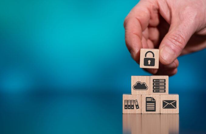 Concept of data protection with icons on wooden cubes